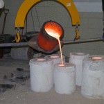 Pouring bronze into molds